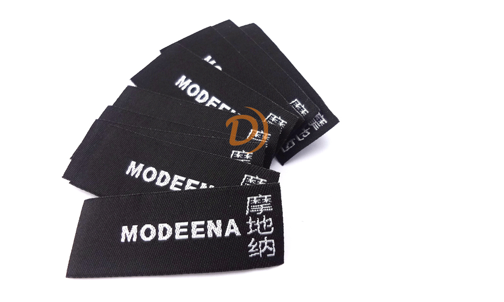 Woven labels with laser-cut edges for precision